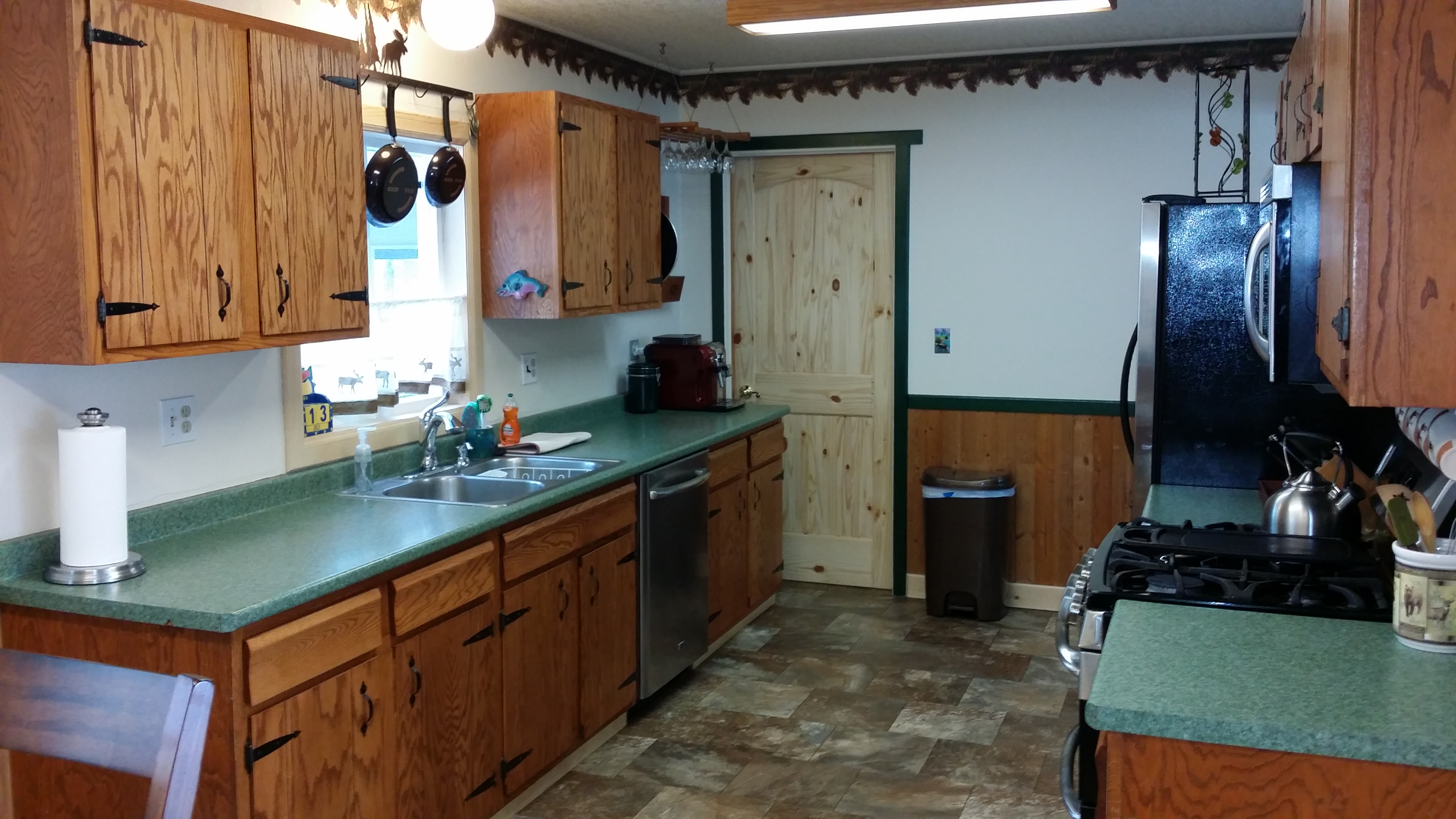 Galley style kitchen with breakfast nook.